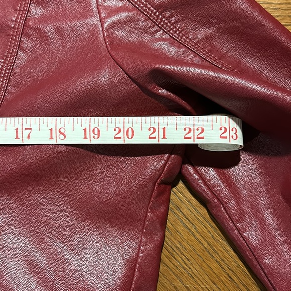 New perfect condition red faux leather jacket. Adorned with zippers and snaps. - Picture 6 of 8